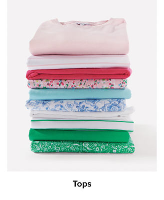 Image of a stack of t-shirts. Shop Tops.