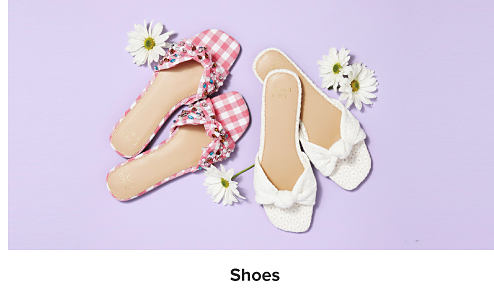 An image of two pairs of flat sandals. Shop shoes.