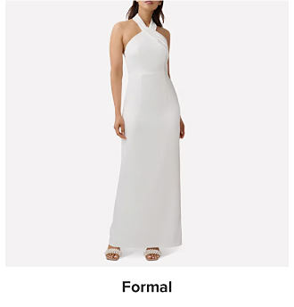 An image of a woman wearing a white floor length gown. Shop formal dresses.