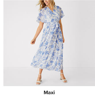 An image of a woman wearing a floral maxi dress. Shop maxi dresses.