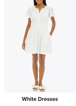 An image of a woman wearing a white dress. Shop white dresses