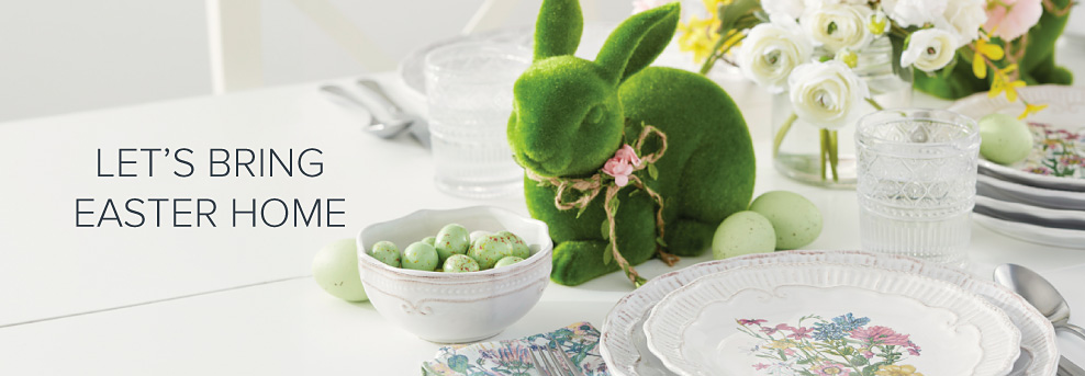 A table set with Easter dinnerware, speckled eggs and a small green rabbit. Let's bring Easter home.