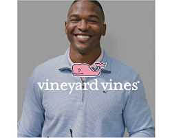 A man in a light blue Vineyard Vines zip up sweater. Shop Vineyard Vines.