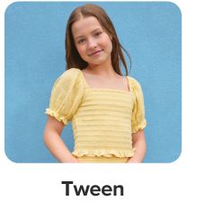 An image of a girl wearing a yellow top. Tween.