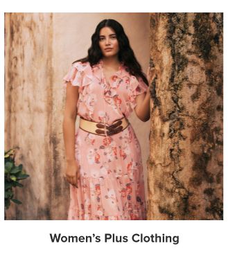 An image of a woman wearing a floral dress. Women's plus clothing. 
