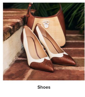 An image of high heels and a handbag. Shoes.