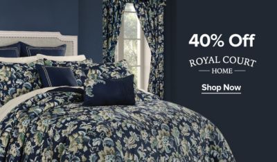 An image of a bed with floral accents. 40% off Royal Court Home. Shop now.