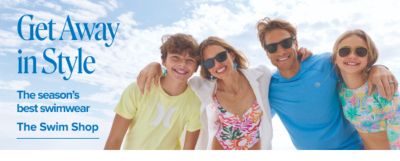 A family wearing swimwear poses together on a beach. Get away in style. The season's best swimswear. The Swim Shop.