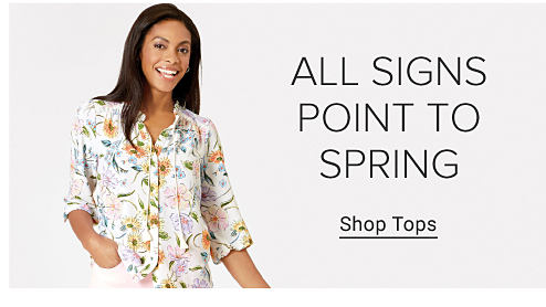 Image of a woman wearing floral top. All Signs Point to Spring. Shop Tops.