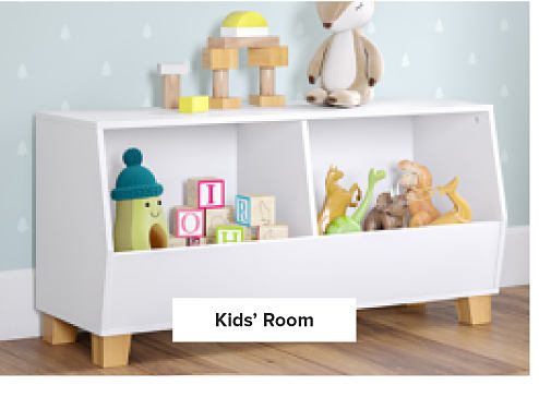 Image of a white shelf holding toys. Kids' room.