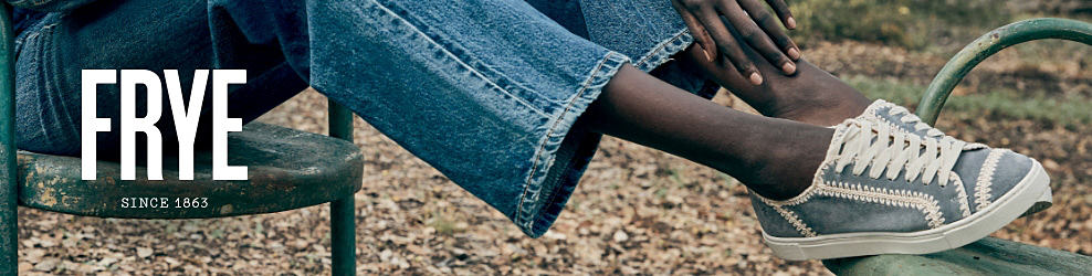 An image of a woman wearing a denim outfit with Frye sneakers. The Frye logo.
