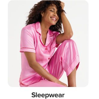 An image of a woman wearing a pink pajama set. Sleepwear.