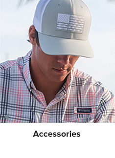 Man wearing a grey and white Columbia hat. Accessories. 