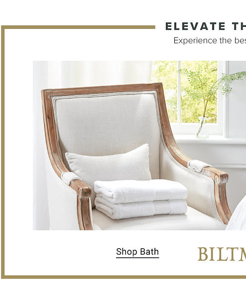 Elevate the everyday. Experience the best in bedding and bath. A stack of white towels on a chair. Shop bath.