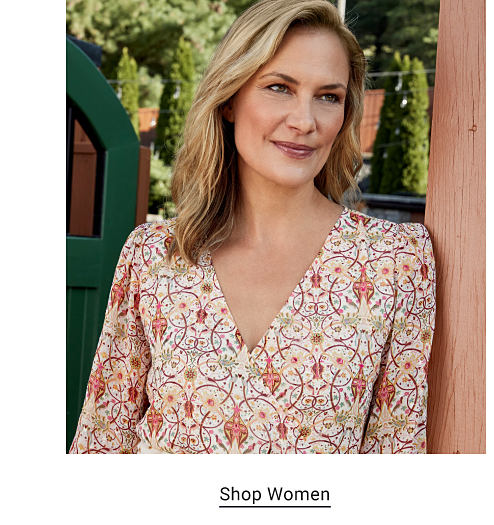 A woman in a floral dress. Shop women. 