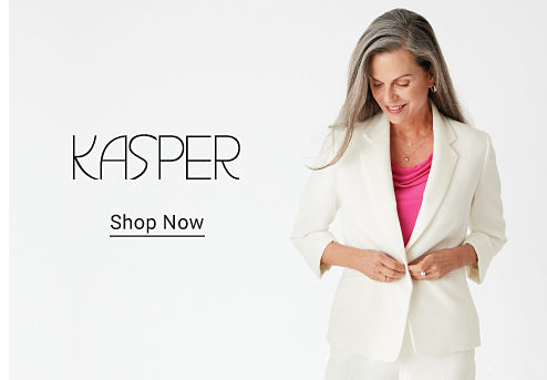 Kasper. Shop now. A woman in a white suit over a pink shirt.