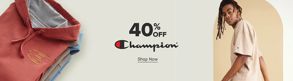 40% off Champion. Shop now. Image of a man in a Champion t-shirt.