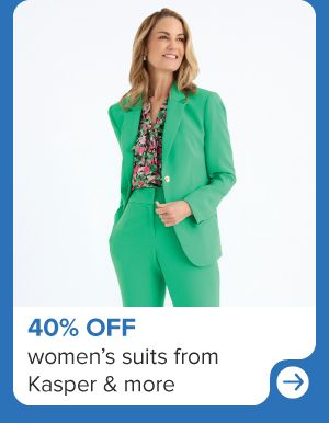 A woman in a bright green suit. 40% off women's suits from Kasper and more.