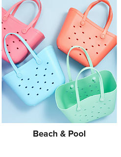 An image of brightly colored plastic beach bags. Shop beach and pool. 