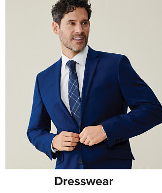 Image of a man in a suit. Shop dresswear.