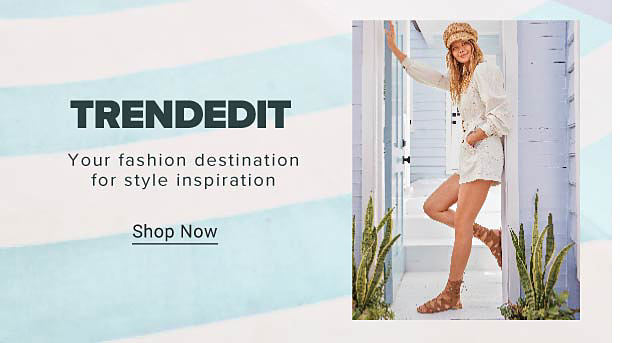TrendEdit. Your fashion destination for style inspiration. Image of girl leaning on doorframe. Shop TrendEdit.
