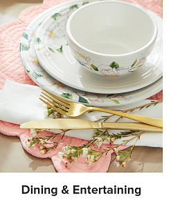 White and green dinnerware and gold cutlery. Shop dining and entertaining.