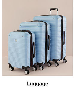 Three blue rolling suitcases. Shop luggage.