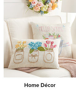 Spring decorative pillows on a coach. Shop home decor.