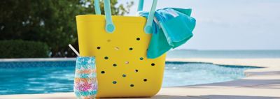 An image of a yellow beach bag and a cup.