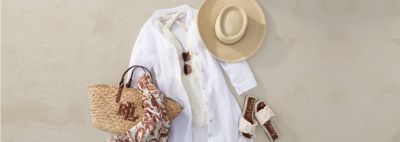 An image featuring a swimsuit, coverup, hat, bag and sandals.