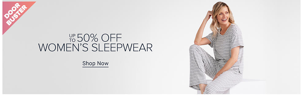 Image of a woman wearing a striped shirt and matching pants. Doorbuster. Up to 50% off women's sleepwear. Shop now. 