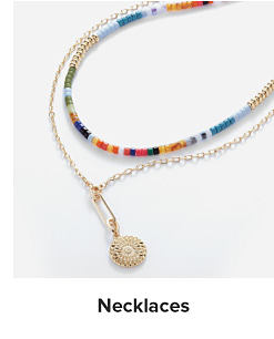 Image of a dainty gold necklace and colorful beaded necklace. Shop necklaces
