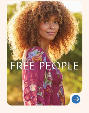 Image of a woman wearing a floral magenta top. Free People logo.