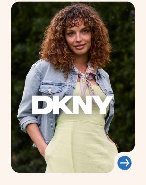 Image of a woman wearing a yellow dress and denim jacket. DKNY logo.