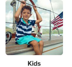 An image of a boy wearing Nautica on a boat. Kids.