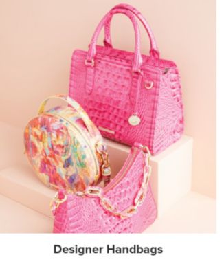 An image of three designer handbags. Shop designer handbags