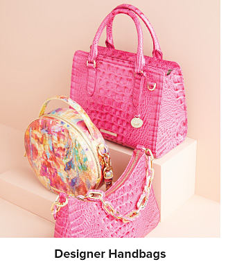 An image of three designer handbags. Shop designer handbags