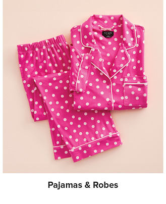 An image of a pink polka dot pajama set. Shop pajamas and robes