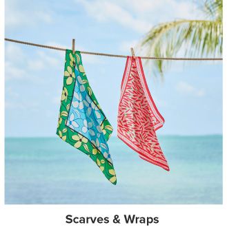 An image of two scarves on a clothes line. Shop scarves and wraps.