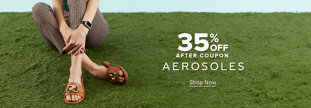 Image of a woman wearing black sandals. 30% off after coupon, Aerosoles.