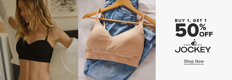 Image of a woman in a black bra. Image of a tan bra and jeans folded on a bed. Buy one, get one 50% off. Jockey. Shop now.
