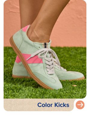 Image of sneakers with a pink stripe. Color kicks.