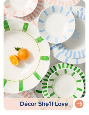 Image of white plates with blue and green designs. Decor she'll love.