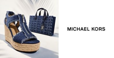 A blue heeled shoe and matching blue bag. Michael Kors.