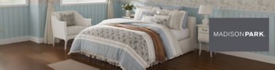 Madison Park. A bed with blue and white bedding.