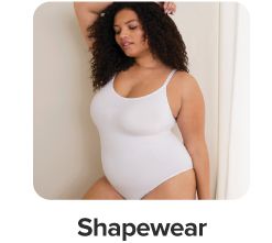 A woman in white shapewar. Shop shapewear.