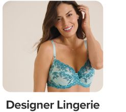 A woman in teal designer lingerie. Shop designer lingerie.