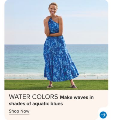 An image of a woman wearing a blue floral dress. Water colors. Make waves in shades of aquatic blues. Shop now.