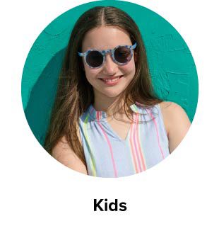 An image of a girl in a striped top and sunglasses. Kids.