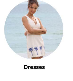 An image of a woman in a casual white dress. Dresses.